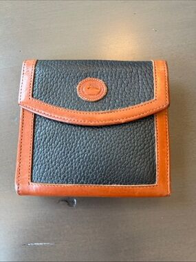 Dooney & Bourke Classic Black Pebbled All Weather Leather Wallet with Tan Trim